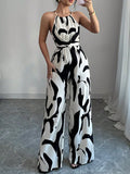 Dominique | Loose Fit Sleeveless Pleated Spaghetti-Neck Jumpsuit